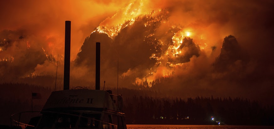 This Monday Sept. 4, 2017, photo provided by KATU-TV shows the Eagle Creek wildfire as seen from Stevenson Wash., across the Columbia River, burning in the Columbia River Gorge above Cascade Locks, Ore. A lengthy stretch of highway Interstate 84 remains closed Tuesday, Sept. 5, as crews battle the wildfire that has also caused evacuations and sparked blazes across the Columbia River in Washington state. (Tristan Fortsch/KATU-TV via AP)
