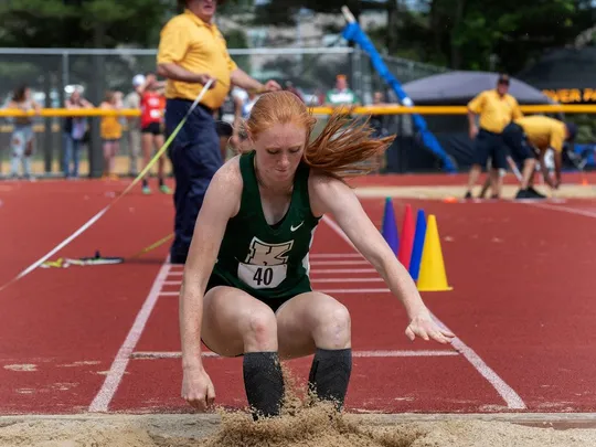 Senior Kathryn Brown competing in triple jump.