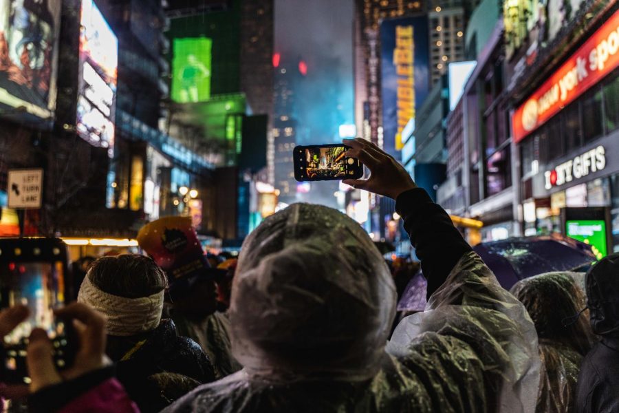 Someone filming the iconic New York City ball drop.