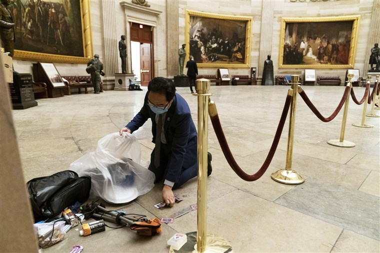 Image from NBC News.
One of the most powerful pictures in American history: New Jersey Congressman Andy Kim on his hands and knees cleaning up the mess in the aftermath of the attempted siege.