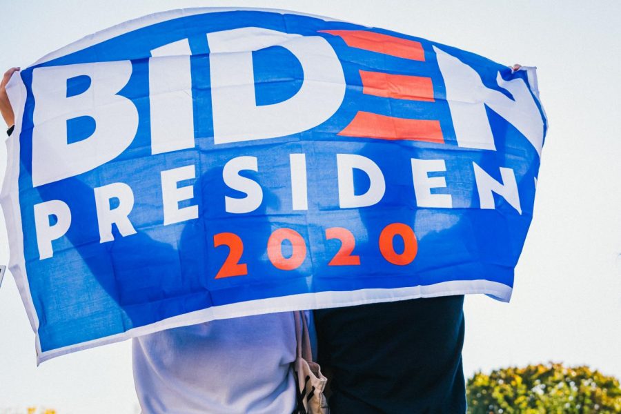 A Biden campaign flag held by supporters.