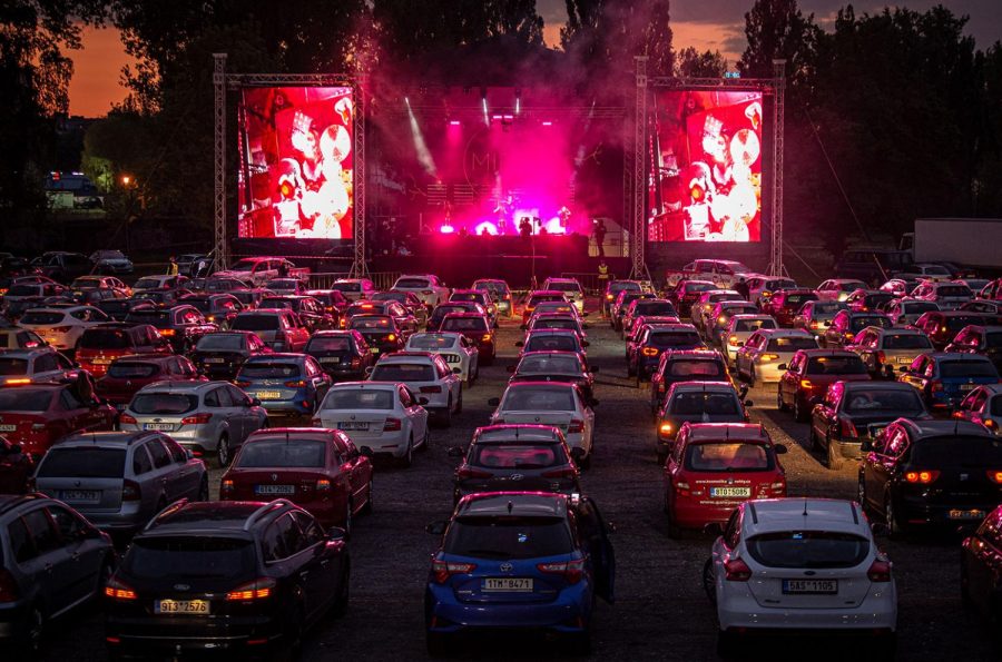 A drive-in concert being performed with a sold out crowd in Los Angeles