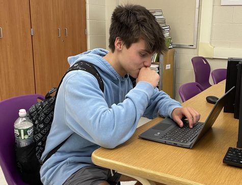 Senior Marco Leitao studiously works on his Chromebook in Journalism 3.