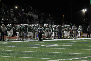 The KHS football team watches on as they play against North Warren. 