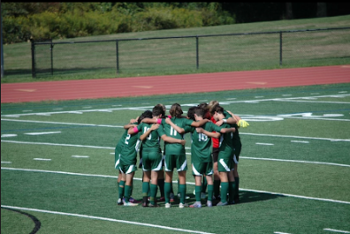  Boys Varsity team on the field for their home opener against Mo Beard