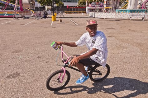 Tyler the Creator, encapsulating his personality on his pink BMX bike