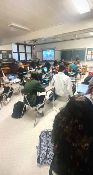 This picture shows Science National Honor Society students listening to a Chemist speak about his school and profession.