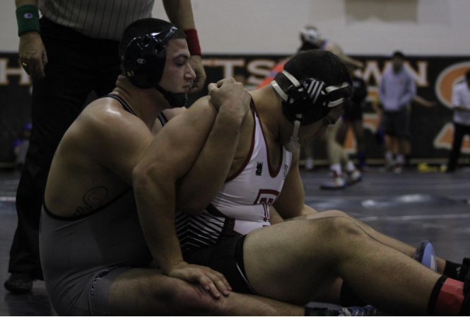 Anthony Colebella wrestling a college opponent.
