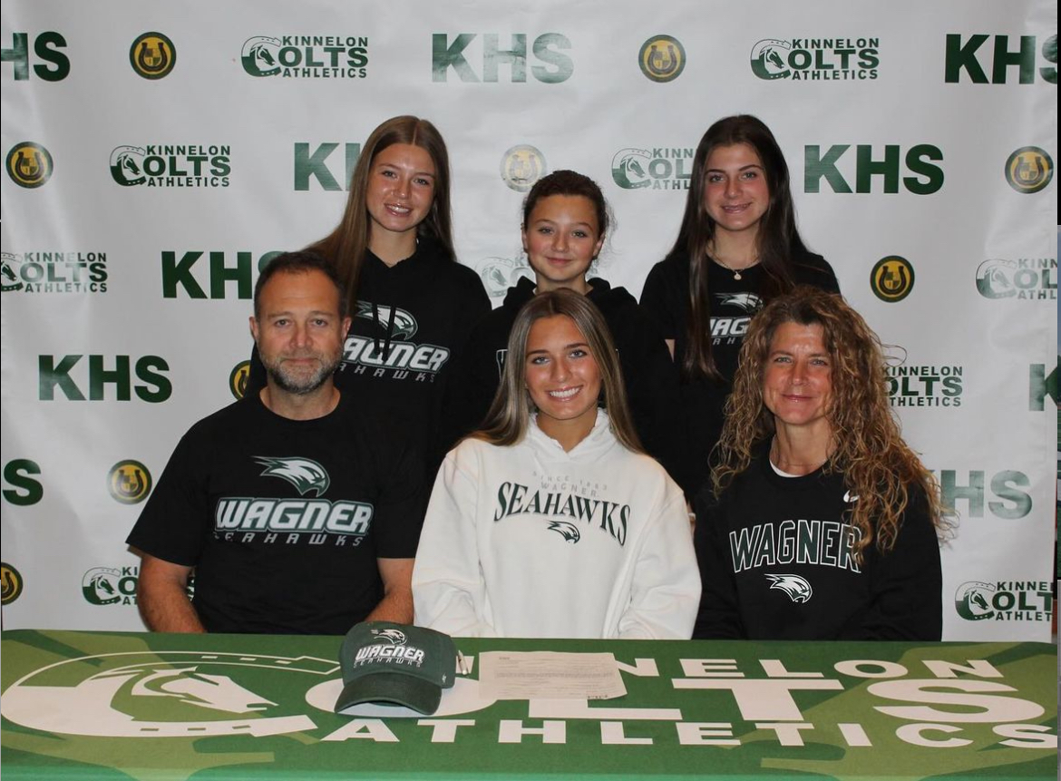 Mortimer and her family on signing day.