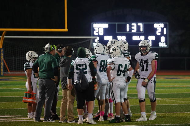 Offensive lineman and players crowd around Kinnelon Coach Jake Grande in the last 1:37 of Kinnelon vs. Pequannock.
	
