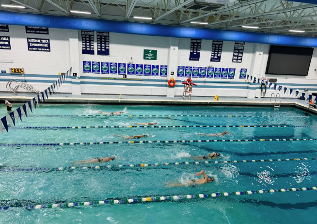 The+KHS+swim+team+warming+up+in+the+pool+for+practice.