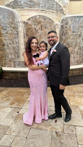 Santaro with her husband and daughter.