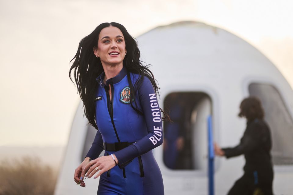 Katy Perry runs off the New Shepard after returning from her 11-minute flight on April 14. (Photo credit: Blue Origin)

