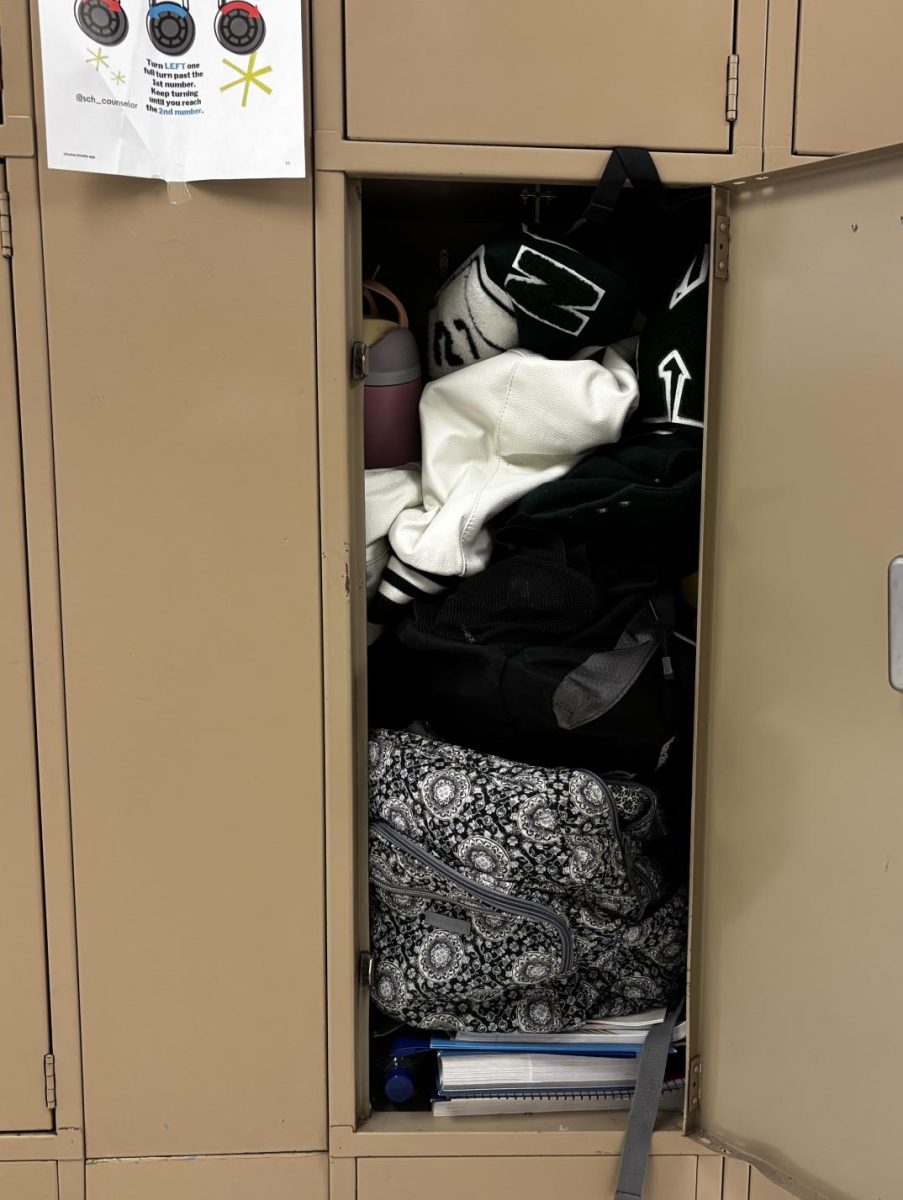 Junior Athlete Natalia Carvajal’s locker overflows in the second-floor hallway.