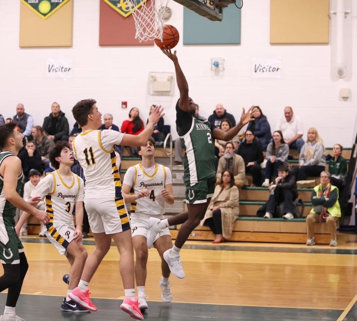  Kinnelon senior Kymanni Hinton drives to the basket during the Colts’ season opener against Pequannock on Dec. 16, 2025. 
