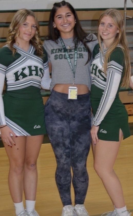 Freshman class president Anica Maksimov (center) stands with Kayla Schablik (left) and Siena Schneider (right), showing off school spirit during a pep rally at Kinnelon High School.