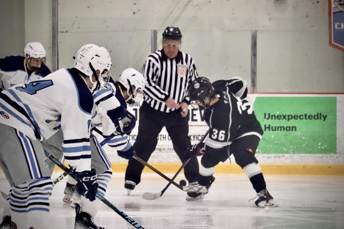 Mar. 2 - Max Rodriguez (#36) battling for the puck against PML