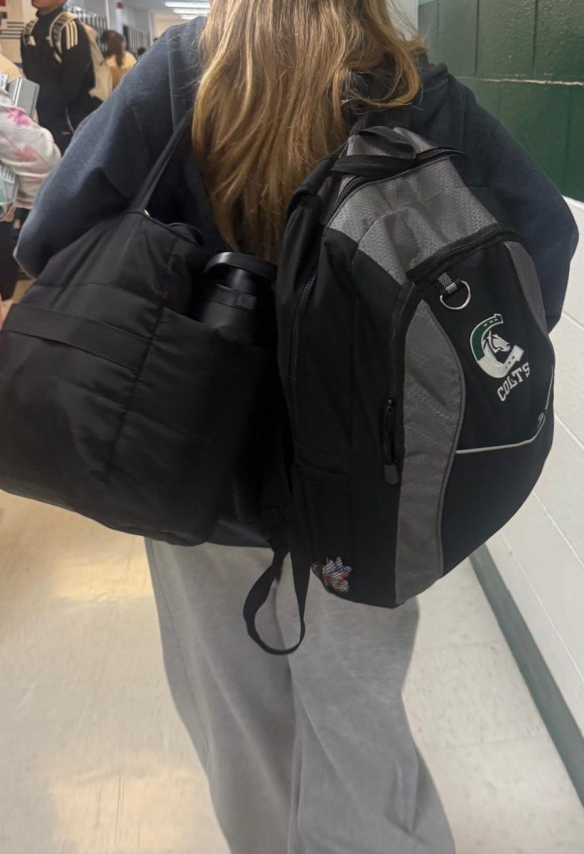 Freshman Emilia Rzekec carries both her track and regular backpacks at Kinnelon High School, reflecting the demands that student-athletes balance daily.
